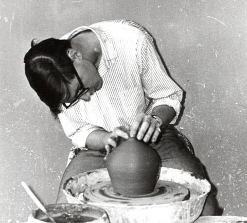Dennis throwing a pot on a wheel, 1967