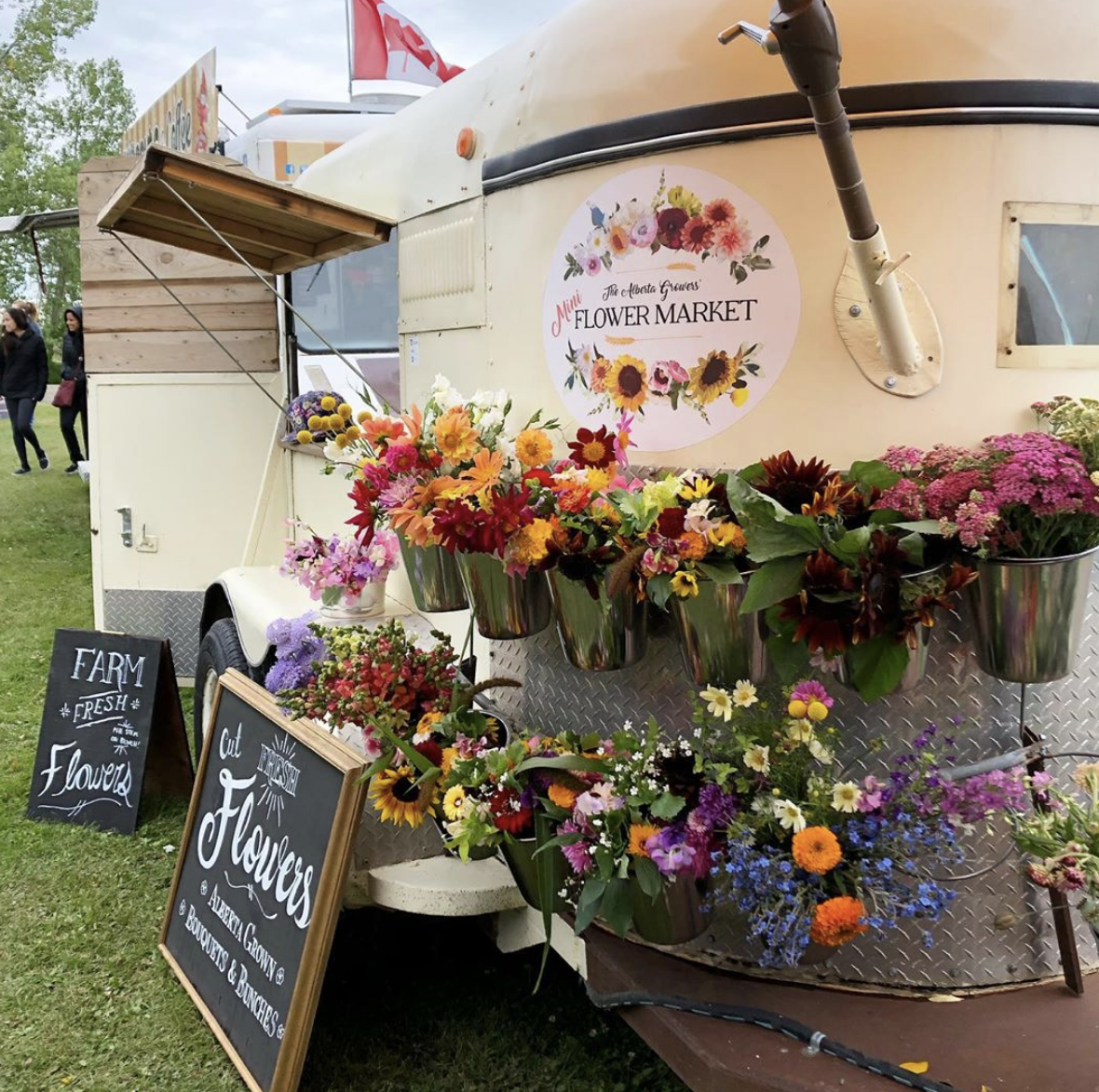 Adams converted an old horse trailer into a pop-up flower shop, pictured here at the Okotoks Farmer's Market Adams converted an old horse trailer into a pop-up flower shop, pictured here at the Okotoks Farmer's Market