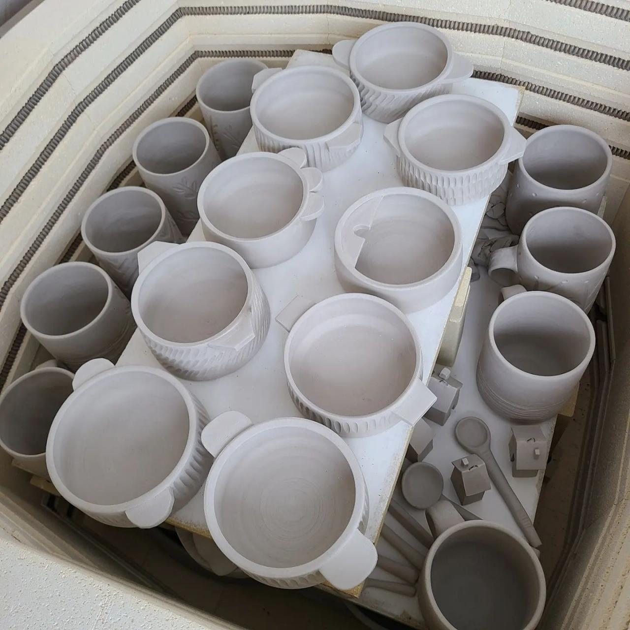 group of ceramic pieces in firing kiln