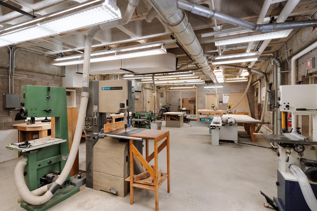 Wood Shop 2 AUArts wood shop with band saws, sanding machines, and woodworking equipment arranged around the space.