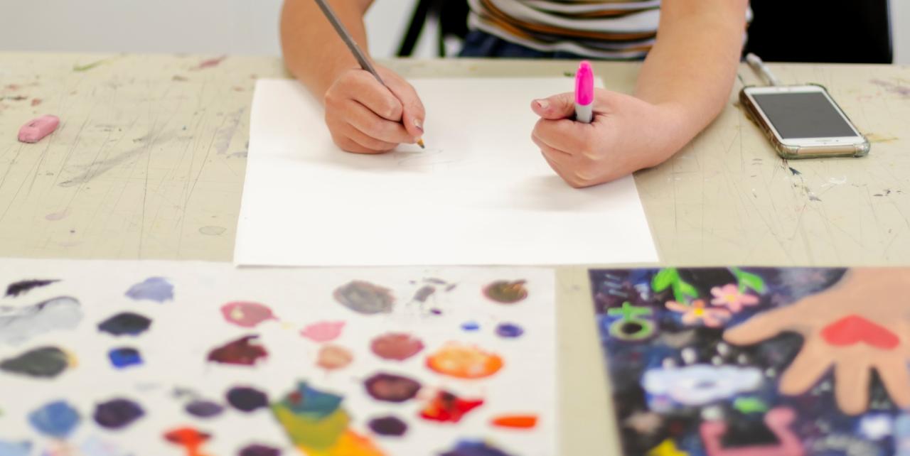 child painting in year-round art class