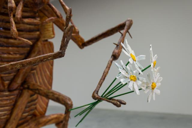 cockroach holding flowers