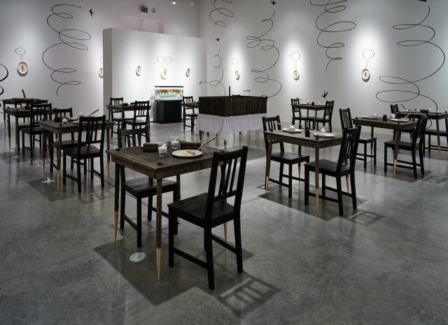 Wide shot of the gallery space leaving the kitchen doors. 