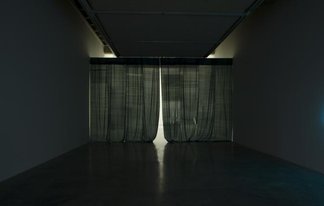 Inside gallery two there is a large curtain obscuring most of the entrance. 
