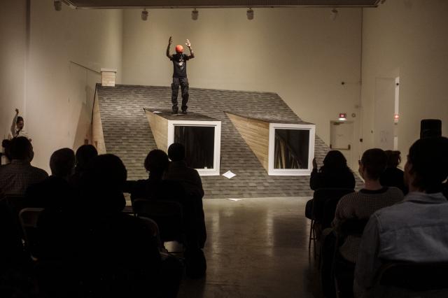 Wakefield Brewster performing at spoken word event in front of an audience