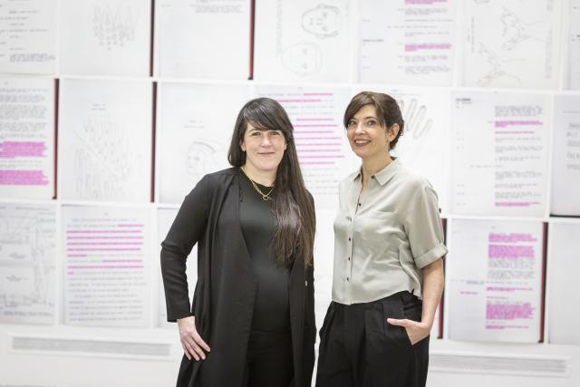 Leila Timmins and Annie MacDonell posing in front of work from The Beyond Within