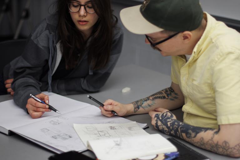 photo: Winner Aigbogun photograph of an art instructor helping a young student with a drawing