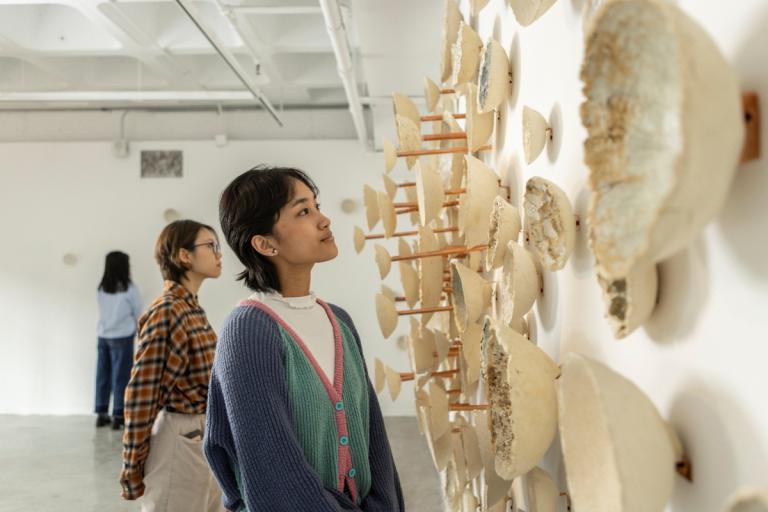 Student looking at ceramic gallery